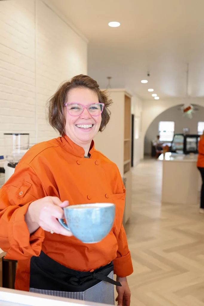 Creekside creamery friendly staff handing coffee in Hortonville